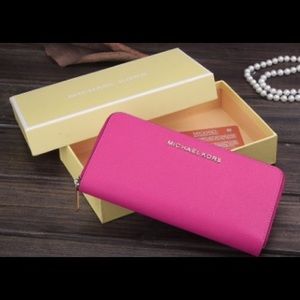 MK pink zip around wallet